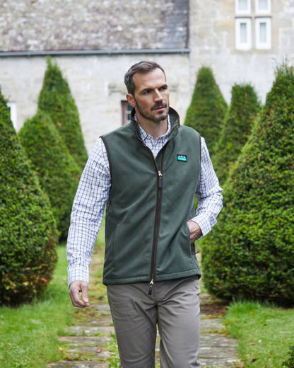 Deep Forest coloured Ridgeline Mens Monarch Gilet on lawn background #colour_deep-forest