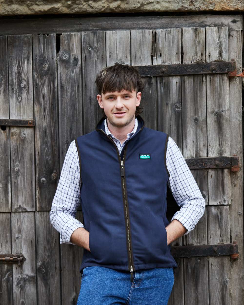 Navy coloured Ridgeline Mens Monarch Gilet on door background #colour_navy
