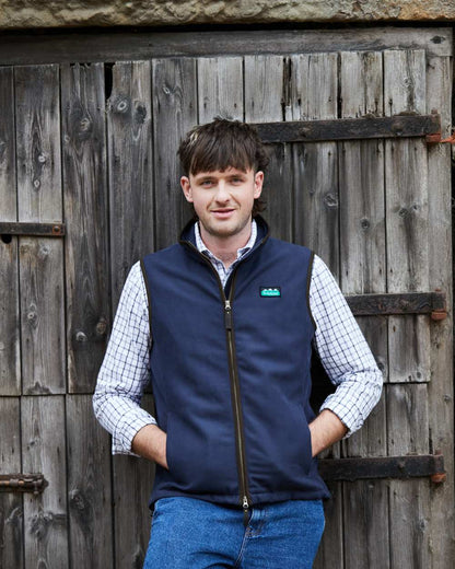 Navy coloured Ridgeline Mens Monarch Gilet on door background #colour_navy