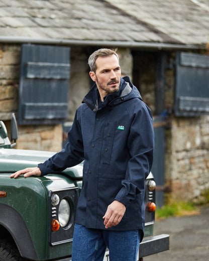 Navy Marl coloured Ridgeline Mens Monsoon Light Jacket on house background #colour_navy-marl