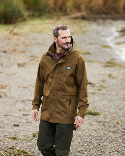 Teak coloured Ridgeline Mens Monsoon Light Jacket on street background #colour_teak