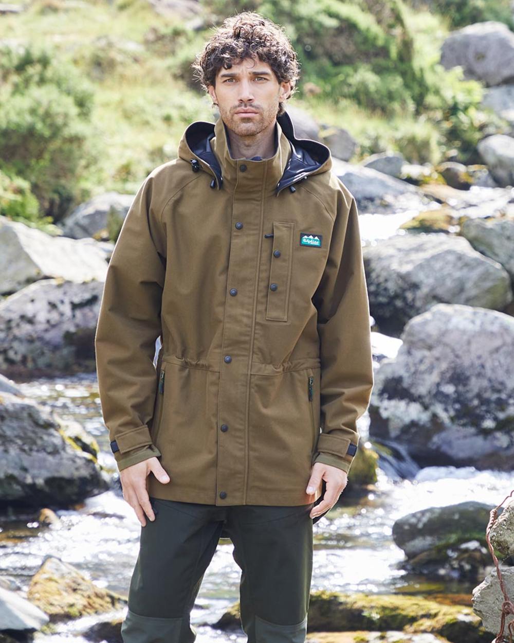 Teak coloured Monsoon Classic Waterproof Jacket on lake background #colour_teak