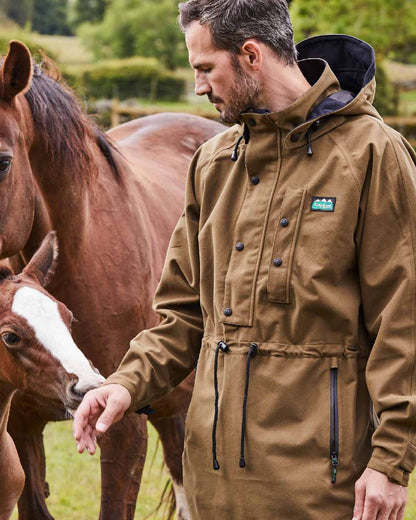 Teak Coloured Ridgeline Monsoon Classic Waterproof Smock on outdoor background #colour_teak