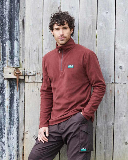 Oxblood coloured Ridgeline Narvik Fleece on yard background #colour_oxblood