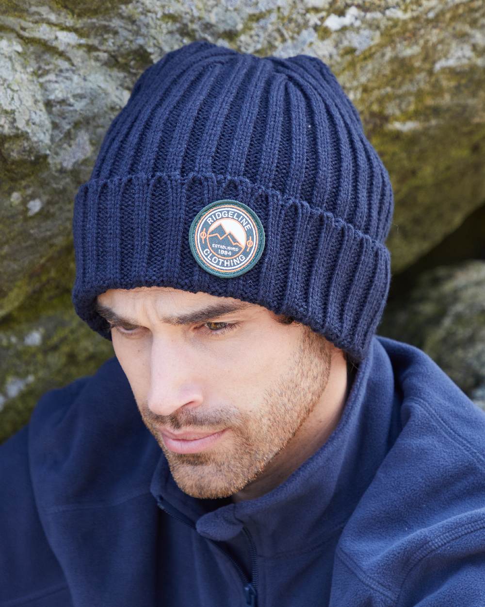 Navy Coloured Ridgeline Original Knitted Beanie on outdoor background #colour_navy