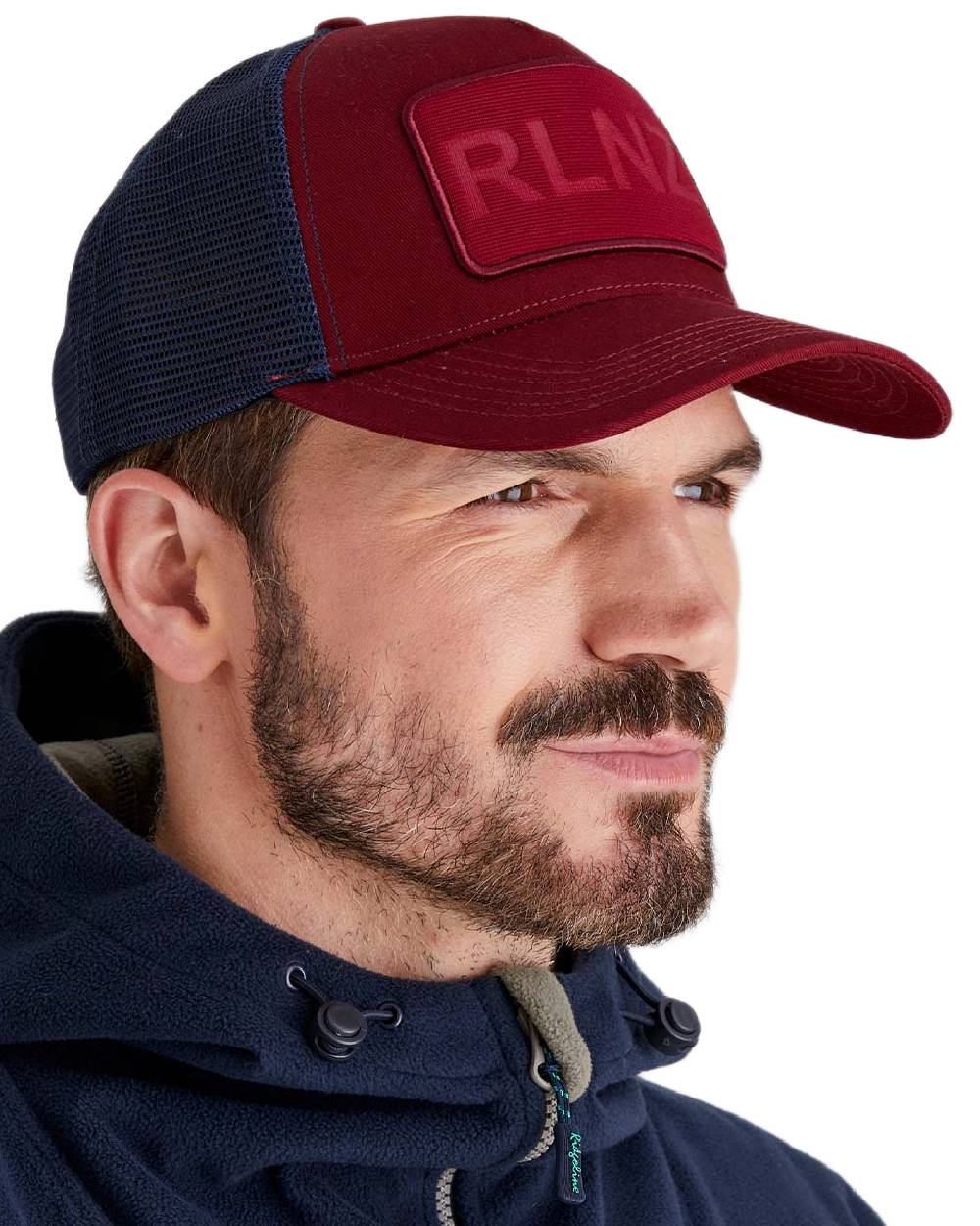Rhubarb Coloured Ridgeline RLNZ Trucker Cap on white background #colour_rhubarb