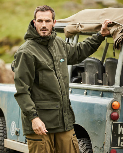 Deep Forest coloured Ridgeline Torrent III Waterproof Jacket on vehicle background #colour_deep-forest