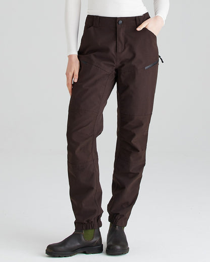 Deep Bark coloured Ridgeline Womens Cambrian Trousers on grey background #colour_deep-bark