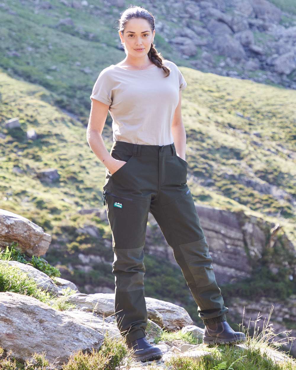 Deep Forest coloured Ridgeline Womens Cambrian Trousers on outdoor background #colour_deep-forest