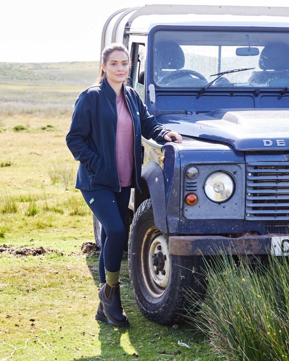 Navy coloured Ridgeline Womens Infinity Leggings on mountain background #colour_navy