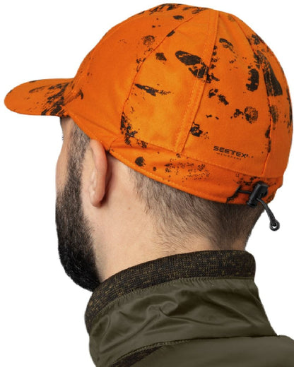 InVis Orange Blaze Coloured Seeland Avail Camo Cap on white background #colour_invis-orange-blaze