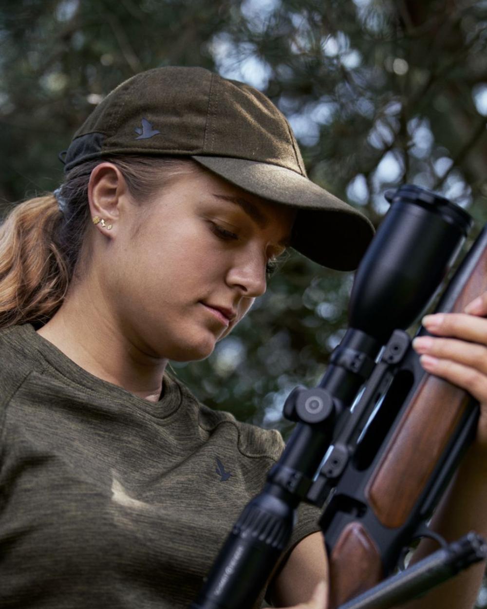 Pine Green Melange Coloured Seeland Avail Cap on forest background #colour_pine-green-melange