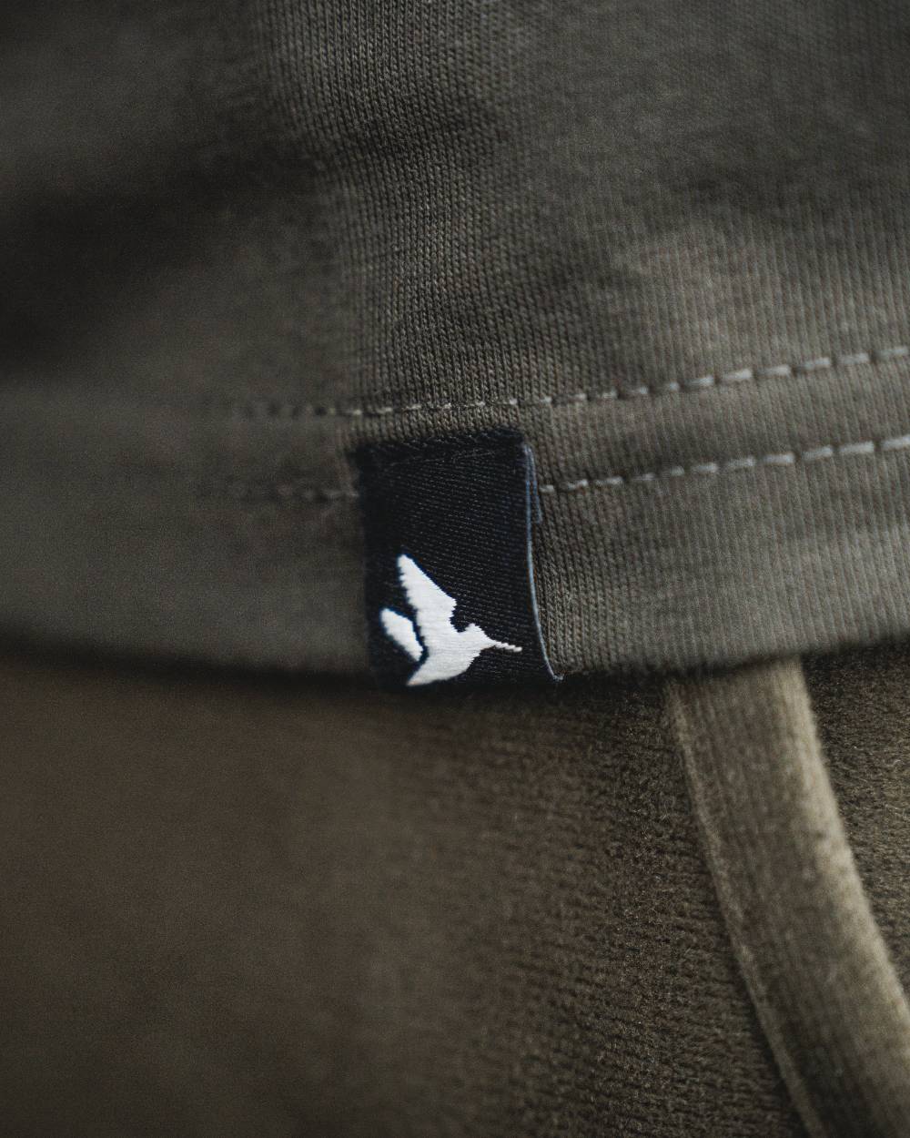 Pine Green coloured Seeland BGH T-Shirt on forest background #colour_pine-green