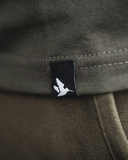 Pine Green coloured Seeland BGH T-Shirt on forest background #colour_pine-green