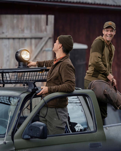 Brown Coloured Seeland Benjamin Fleece on farm background #colour_brown