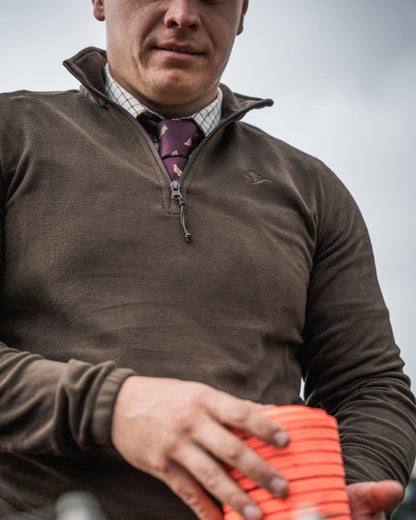 Pine Green Coloured Seeland Benjamin Half Zip Fleece on outdoor background #colour_pine-green