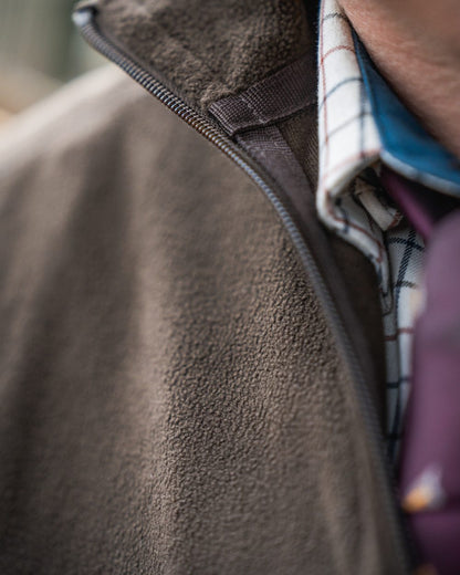 Pine Green Coloured Seeland Benjamin Half Zip Fleece on outdoor background #colour_pine-green