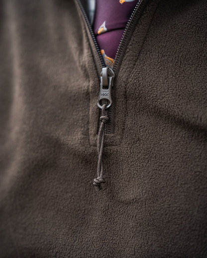 Pine Green Coloured Seeland Benjamin Half Zip Fleece on outdoor background #colour_pine-green