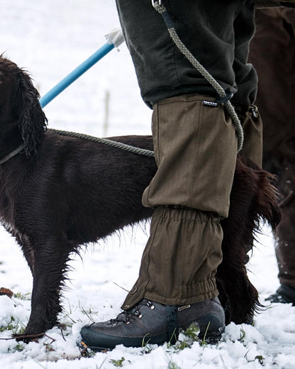 Shaded Olive Coloured Seeland Buckthorn Gaiters on snow background #colour_shaded-olive