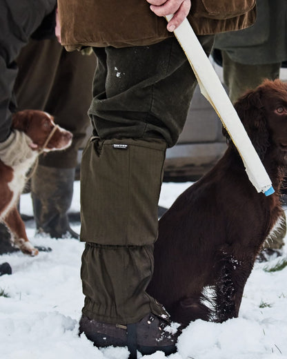 Shaded Olive Coloured Seeland Buckthorn Gaiters on snow background #colour_shaded-olive