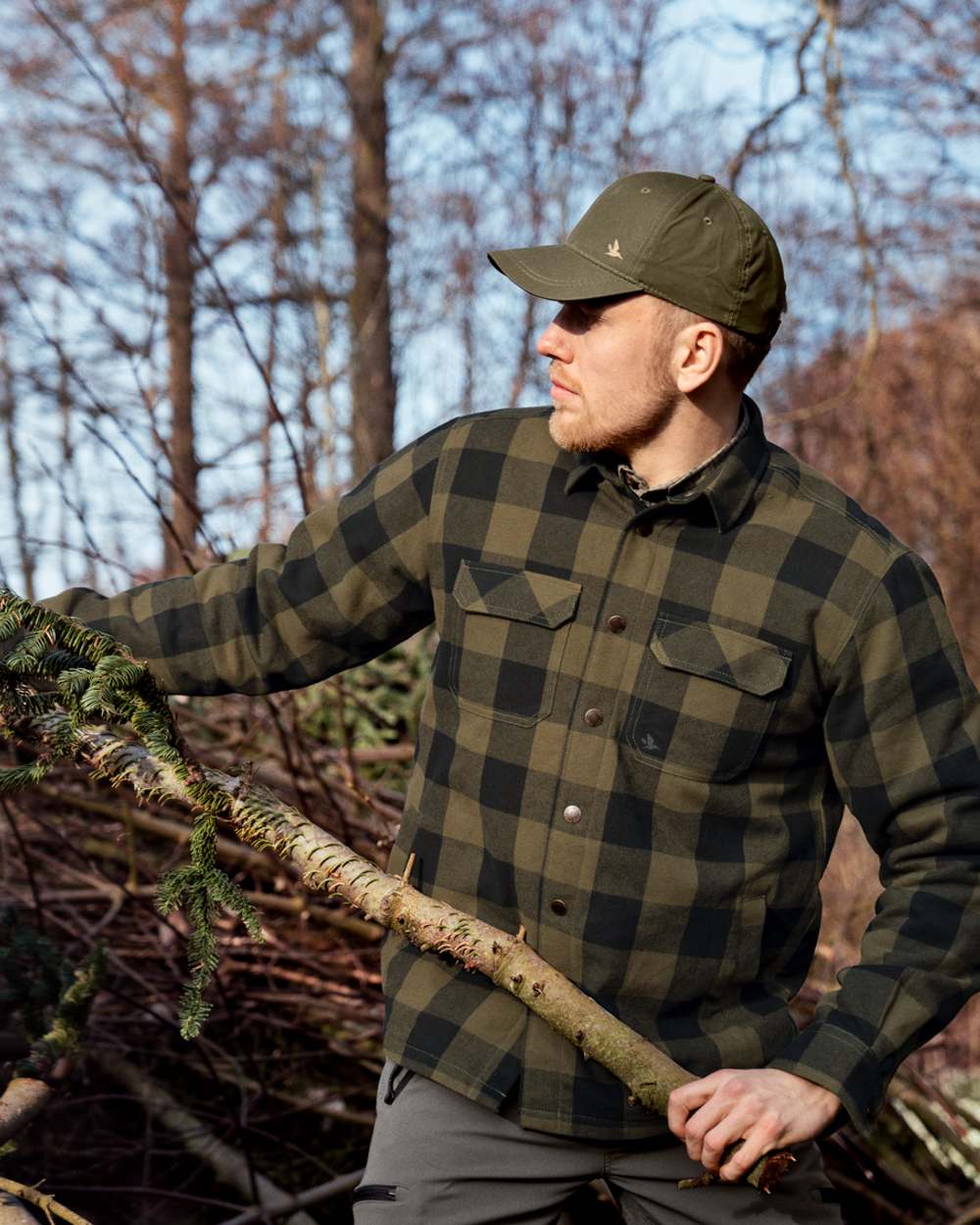 Green Check Coloured Seeland Canada Quilted Shirt on forest background #colour_green-check