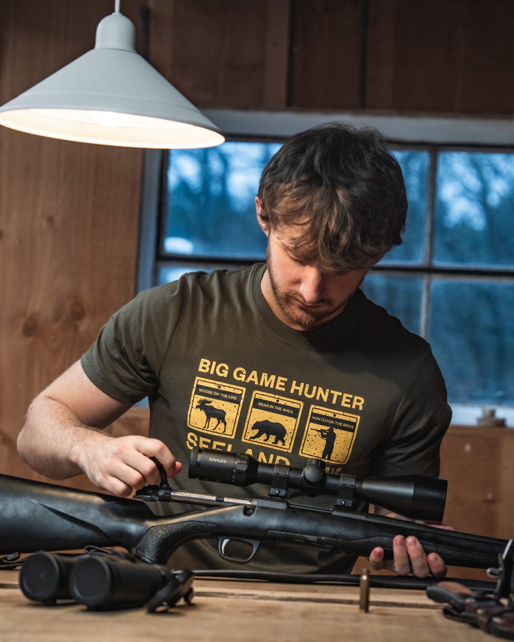 Grape Leaf Coloured Seeland Caution T-Shirt on indoor background #colour_grape-leaf