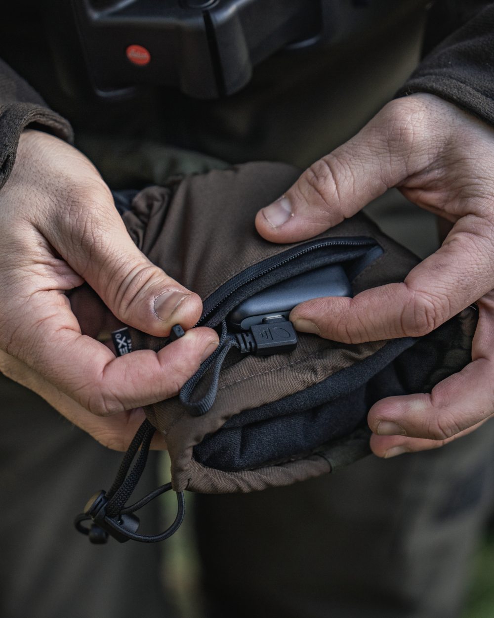 Pine Green coloured Seeland Celsius Heat Gloves on forest background #colour_pine-green