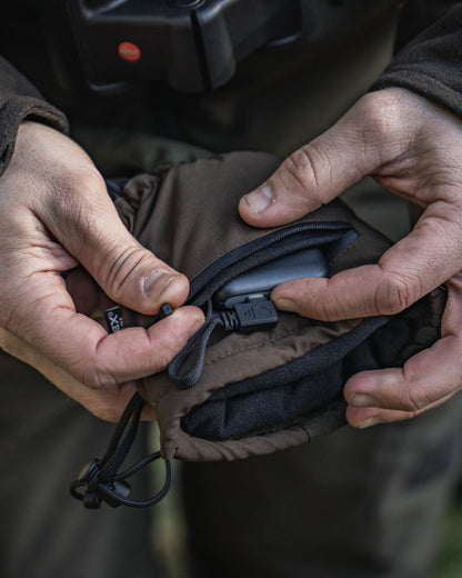 Pine Green coloured Seeland Celsius Heat Gloves on forest background #colour_pine-green
