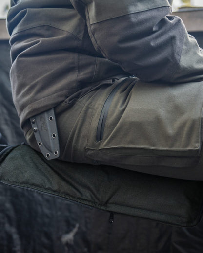 Pine Green coloured Seeland Celsius Heat Seat Pad on forest background #colour_pine-green