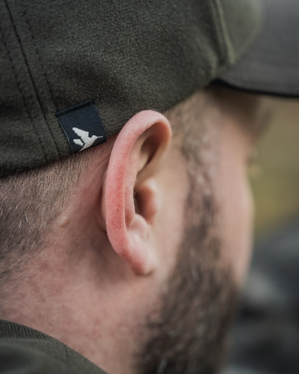 Pine Green coloured Seeland Chaser BGH Cap on forest background #colour_pine-green