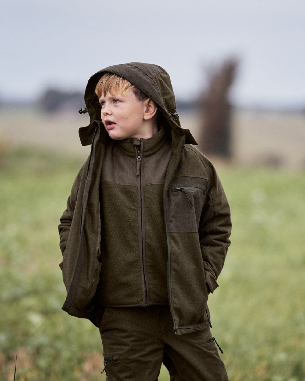 Pine Green Melange Coloured Seeland Childrens Avail Jacket on outdoor background #colour_pine-green-melange