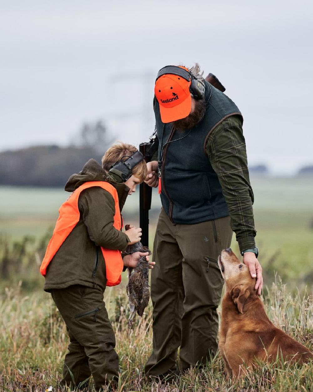 Pine Green Melange Coloured Seeland Childrens Avail Trousers on forest background #colour_pine-green-melange