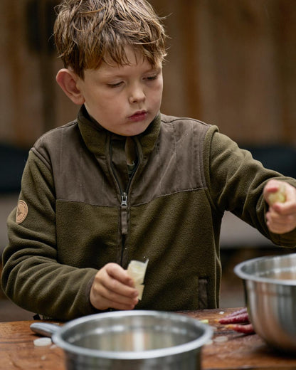 Pine Green Coloured Seeland Childrens Bolt Fleece Jacket on outdoor background #colour_pine-green