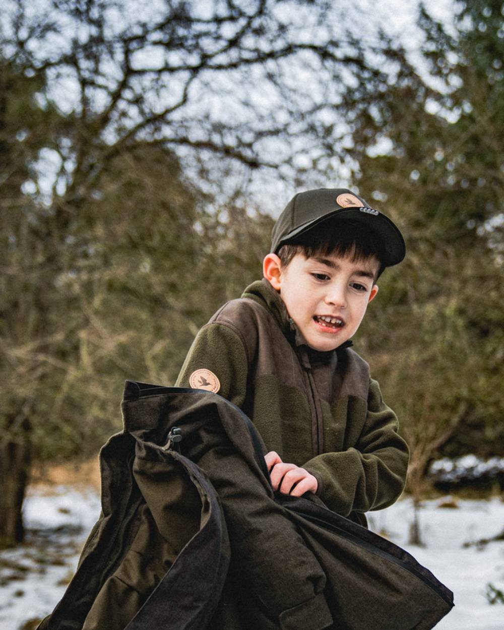 Pine Green Coloured Seeland Childrens Bolt Fleece Jacket on outdoor background #colour_pine-green