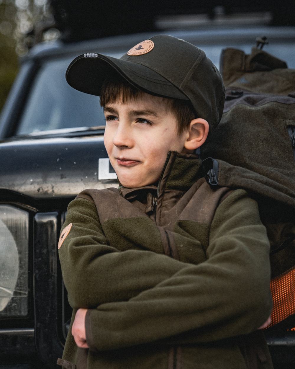 Pine Green Coloured Seeland Childrens Bolt Fleece Jacket on outdoor background #colour_pine-green