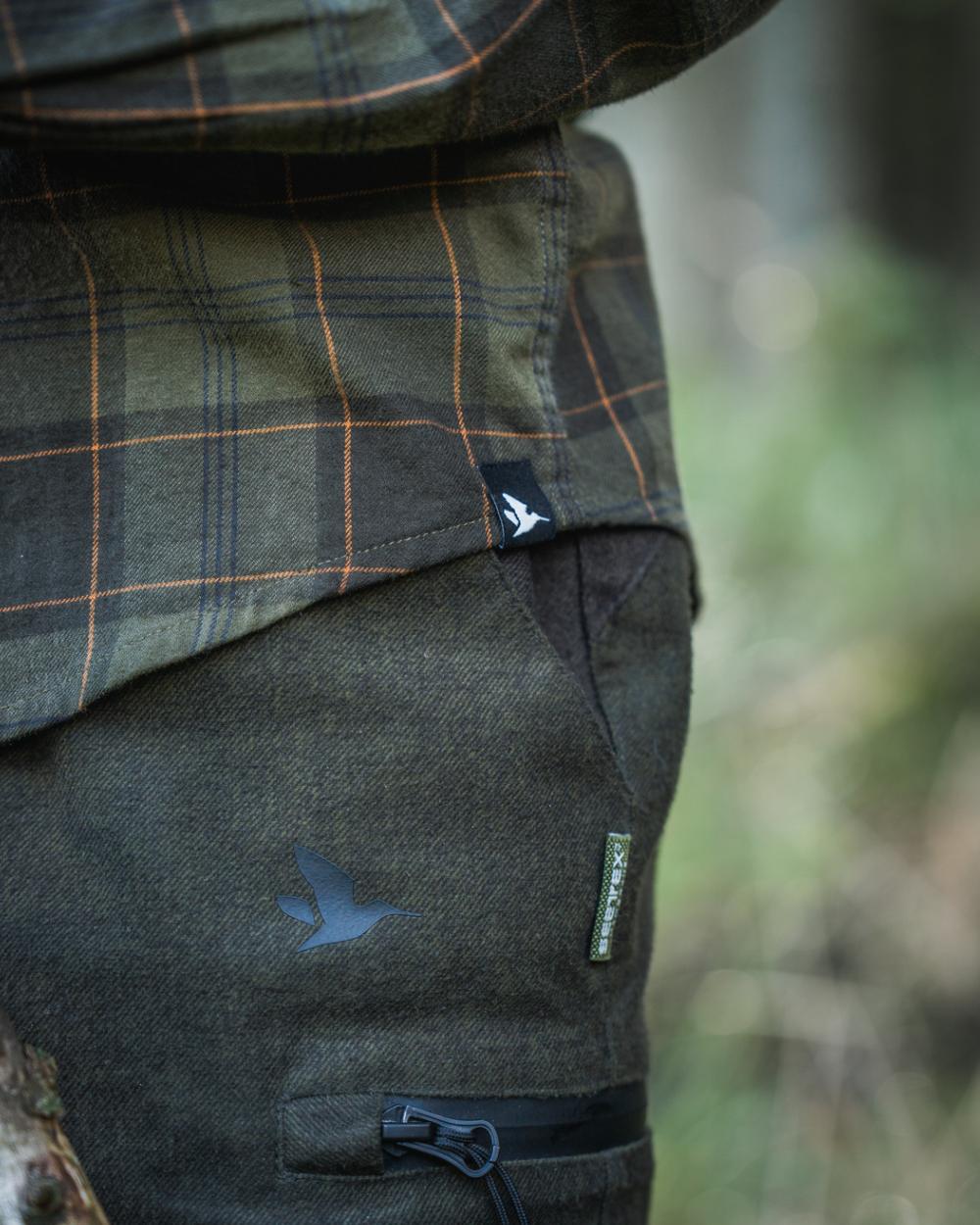 Pine Green Dark Navy Check Coloured Seeland Childrens Glen Flannel Shirt on outdoor background #colour_pine-green-dark-navy-check