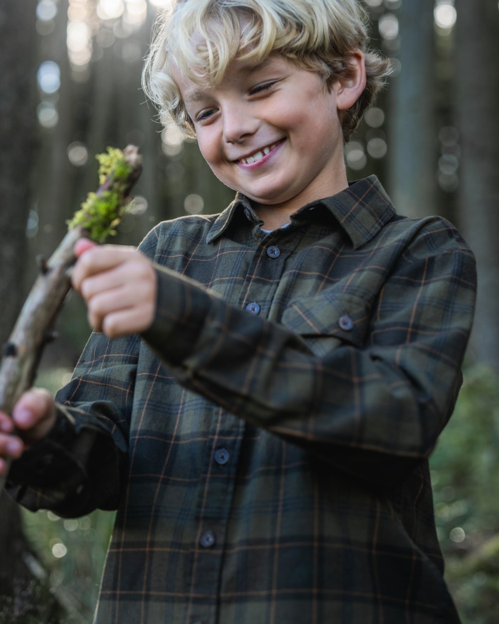 Pine Green Dark Navy Check Coloured Seeland Childrens Glen Flannel Shirt on outdoor background #colour_pine-green-dark-navy-check