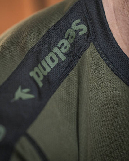 Light Pine Coloured Seeland Crest Baselayer on outdoor background #colour_light-pine