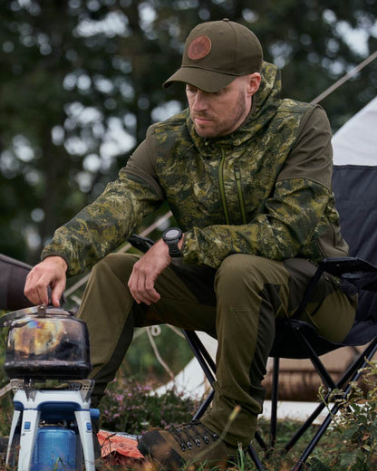 InVis Green Coloured Seeland Cross Windbeater Jacket on outdoor  background #colour_invis-green