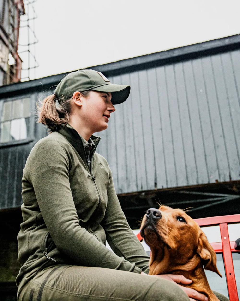 Pine Green Coloured Seeland Dew Fleece Jacket on outdoor background #colour_pine-green