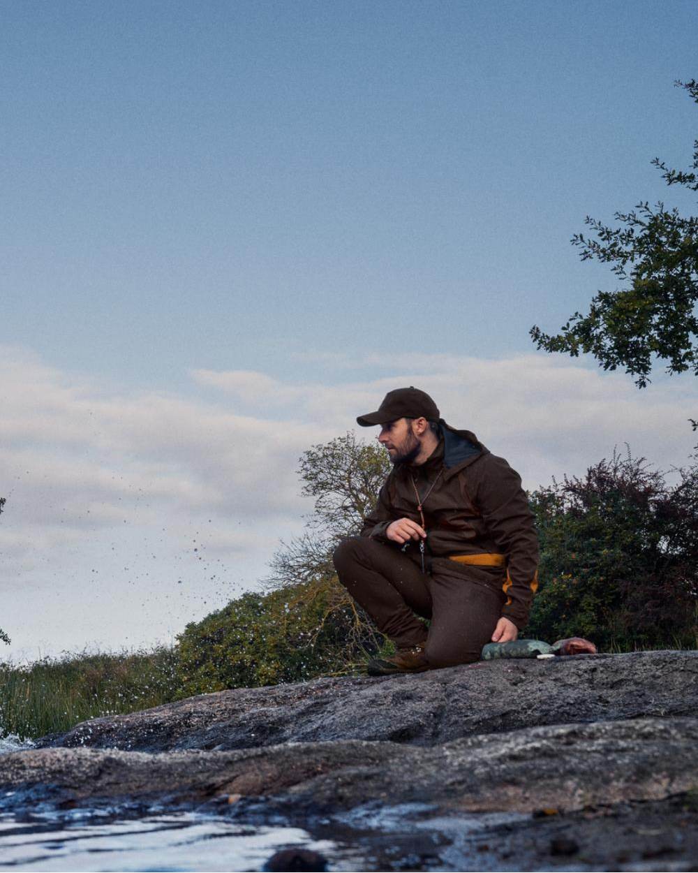 Dark Brown Coloured Seeland Dog Active Jacket On A Forest Background #colour_dark-brown