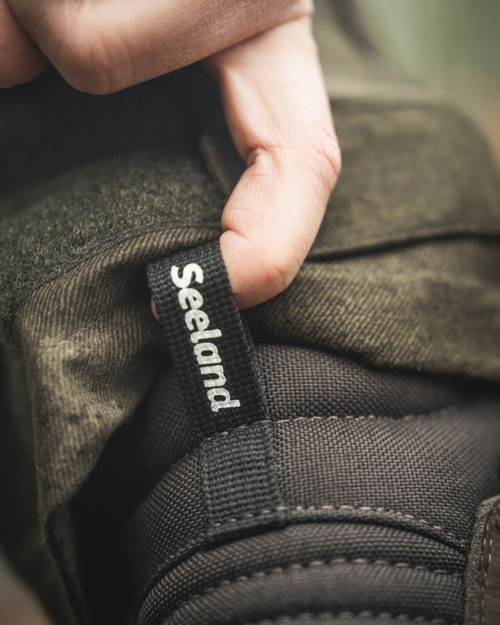 Dark Brown coloured Seeland Enduro Dial Aya Boots on forest background #colour_dark-brown