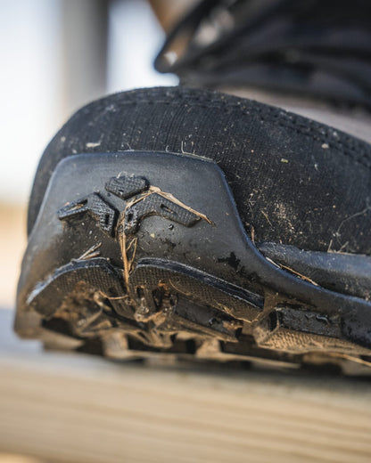 Dark Brown coloured Seeland Enduro Explore Mid Boots on forest background #colour_dark-brown