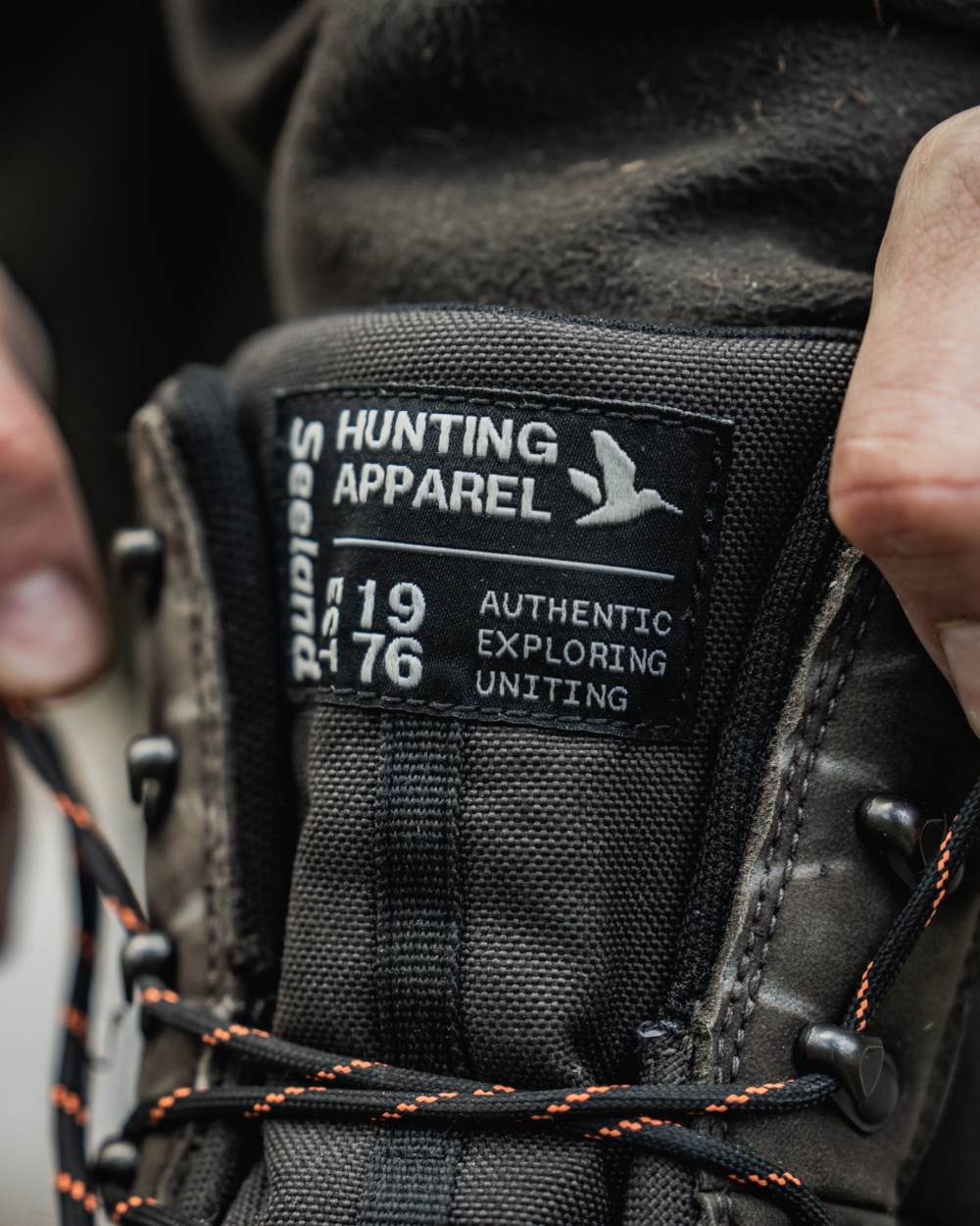 Dark Brown coloured Seeland Enduro Tracker High Boots on forest background #colour_dark-brown