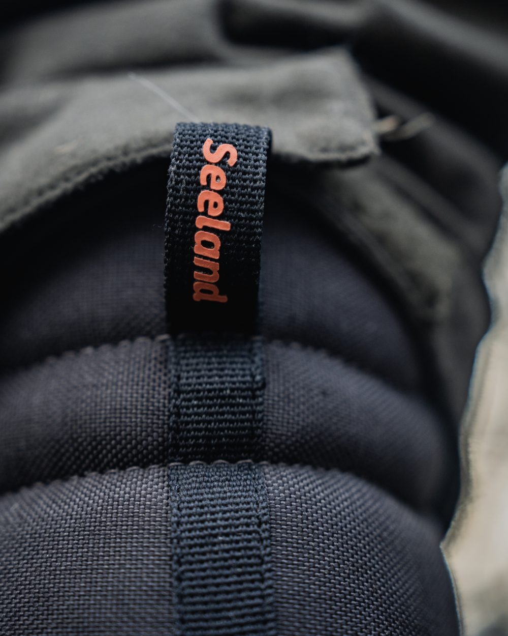 Dark Brown coloured Seeland Enduro Tracker High Boots on forest background #colour_dark-brown