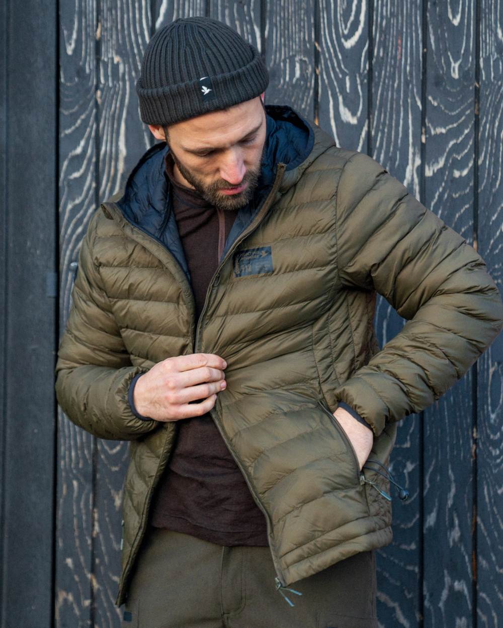 Military Olive coloured Seeland Fahrenheit Jacket on wood background #colour_military-olive