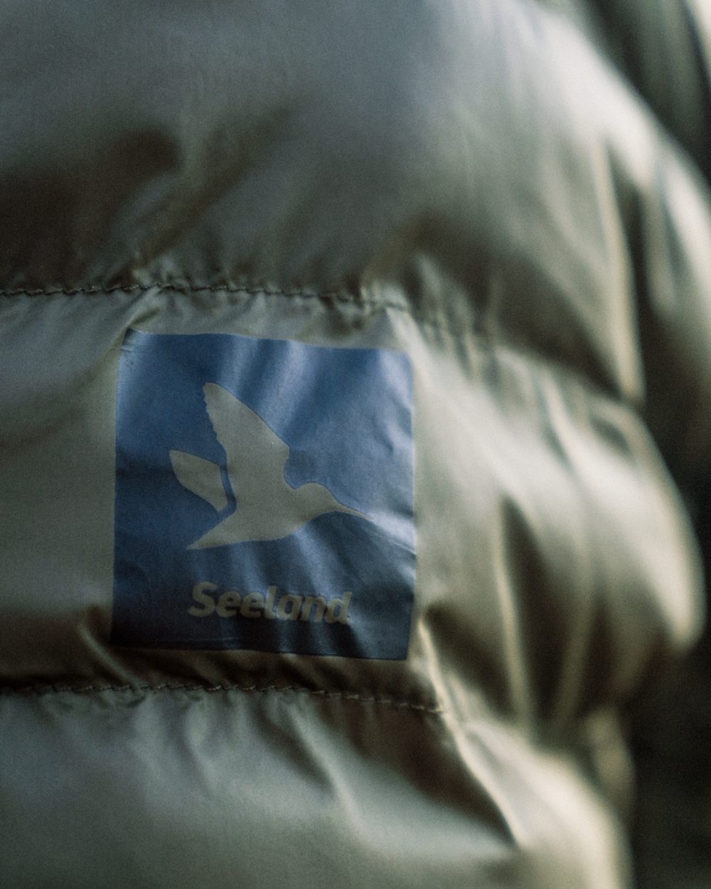 Military Olive coloured Seeland Fahrenheit Jacket on white background #colour_military-olive