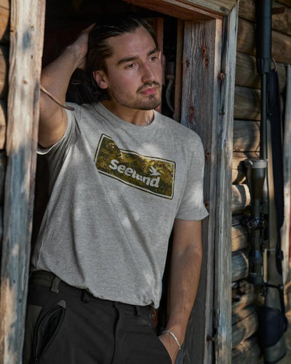 Dark Grey Melange Coloured Seeland Falcon T-Shirt on house background #colour_dark-grey-melange