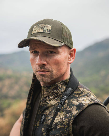 Pine Green Coloured Seeland Ganister Trucker Cap on outdoor background #colour_pine-green