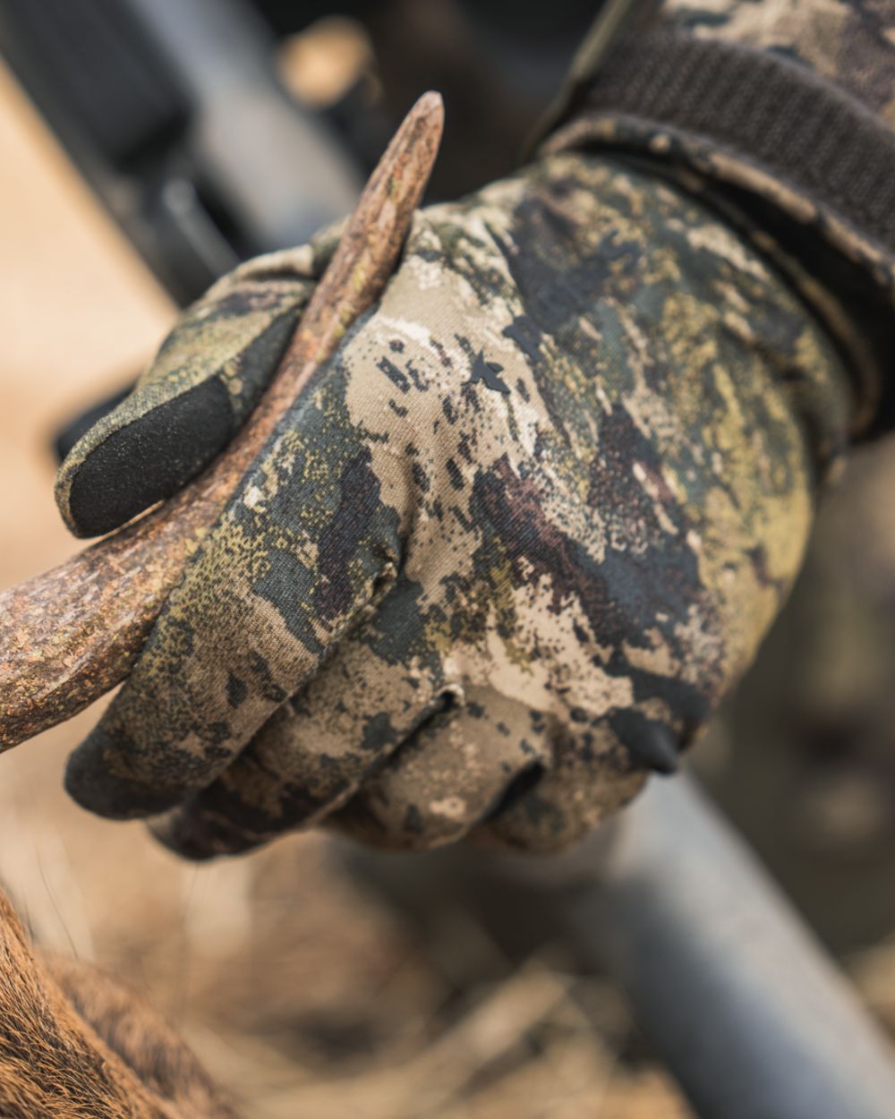 InVis MPC Green coloured Seeland Grip Camo Gloves on forest background #colour_invis-mpc-green